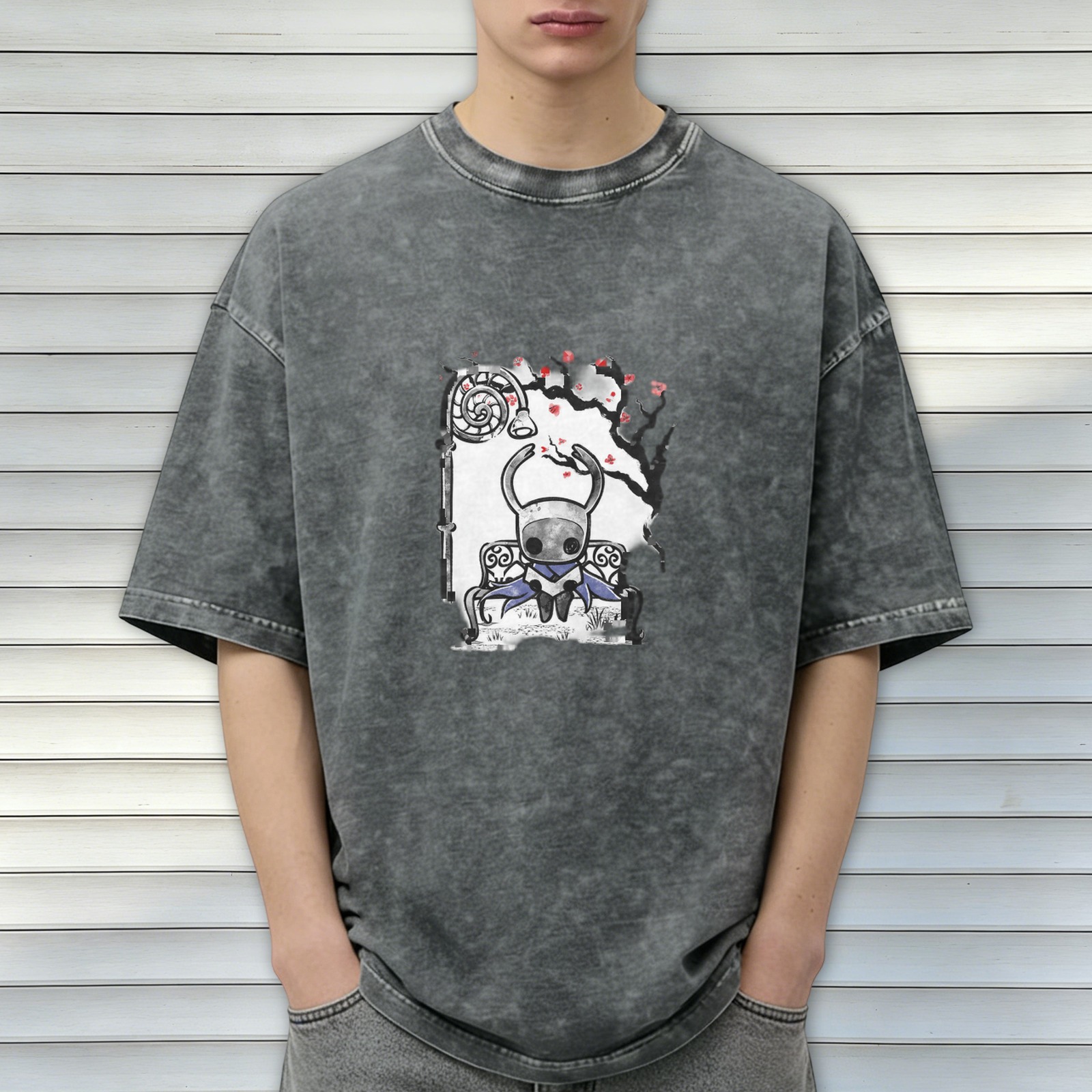 Washed black graphic t-shirt with Hollow Knight character on bench