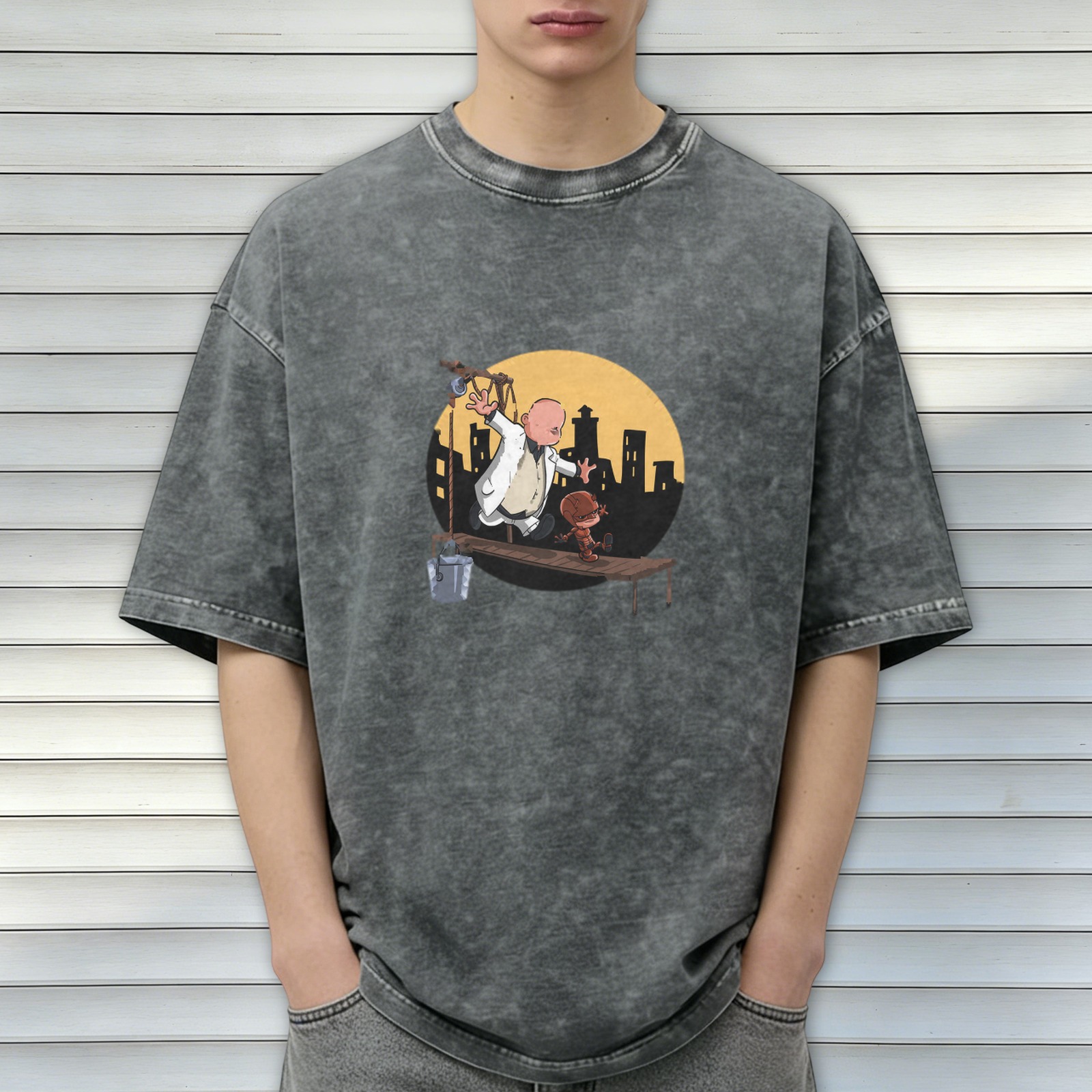 Washed black graphic t-shirt with cartoon characters on a scaffold city skyline