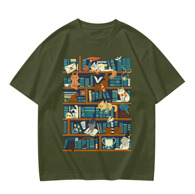 Olive t-shirt with playful cats on a bookshelf graphic