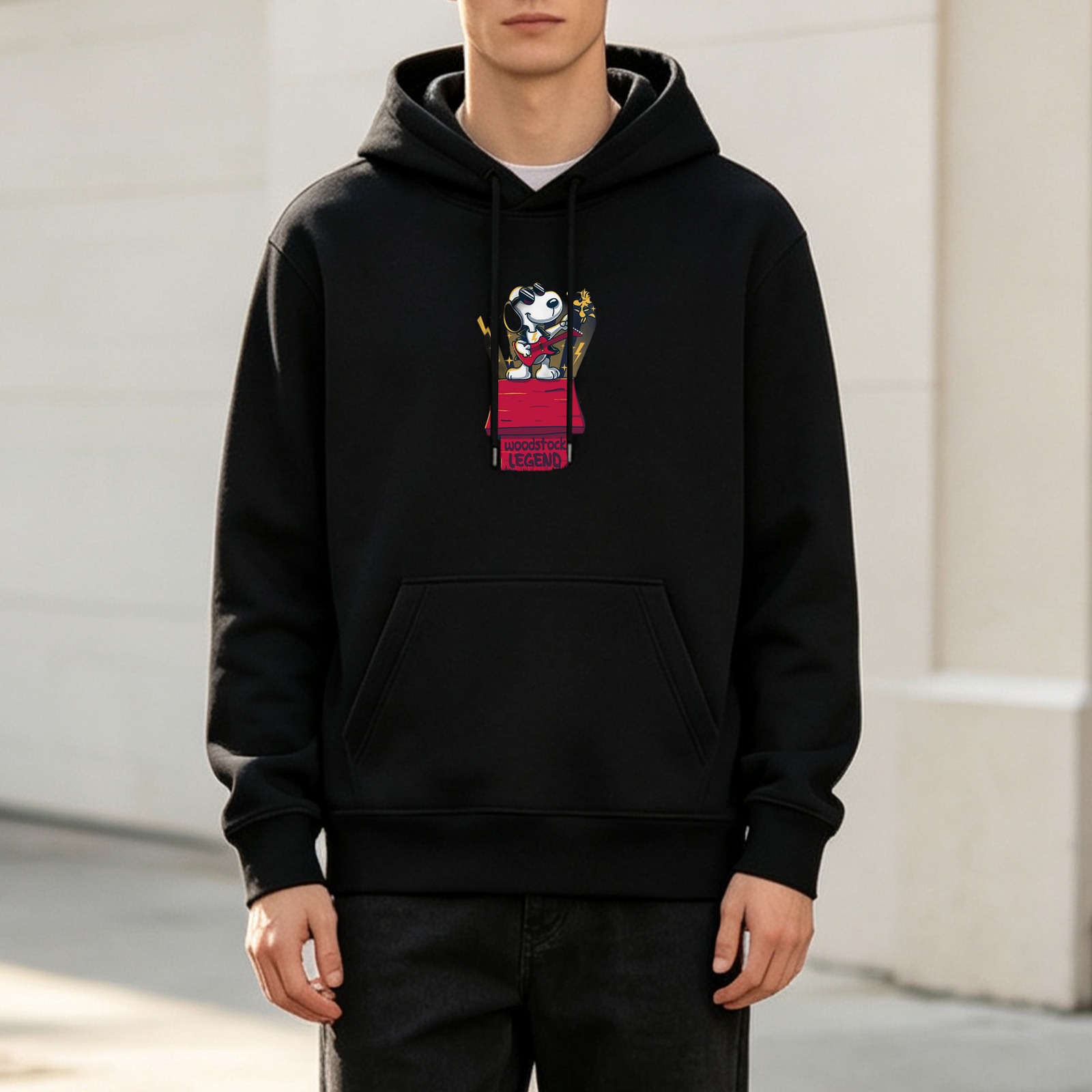 Black hoodie with Snoopy playing guitar on doghouse graphic