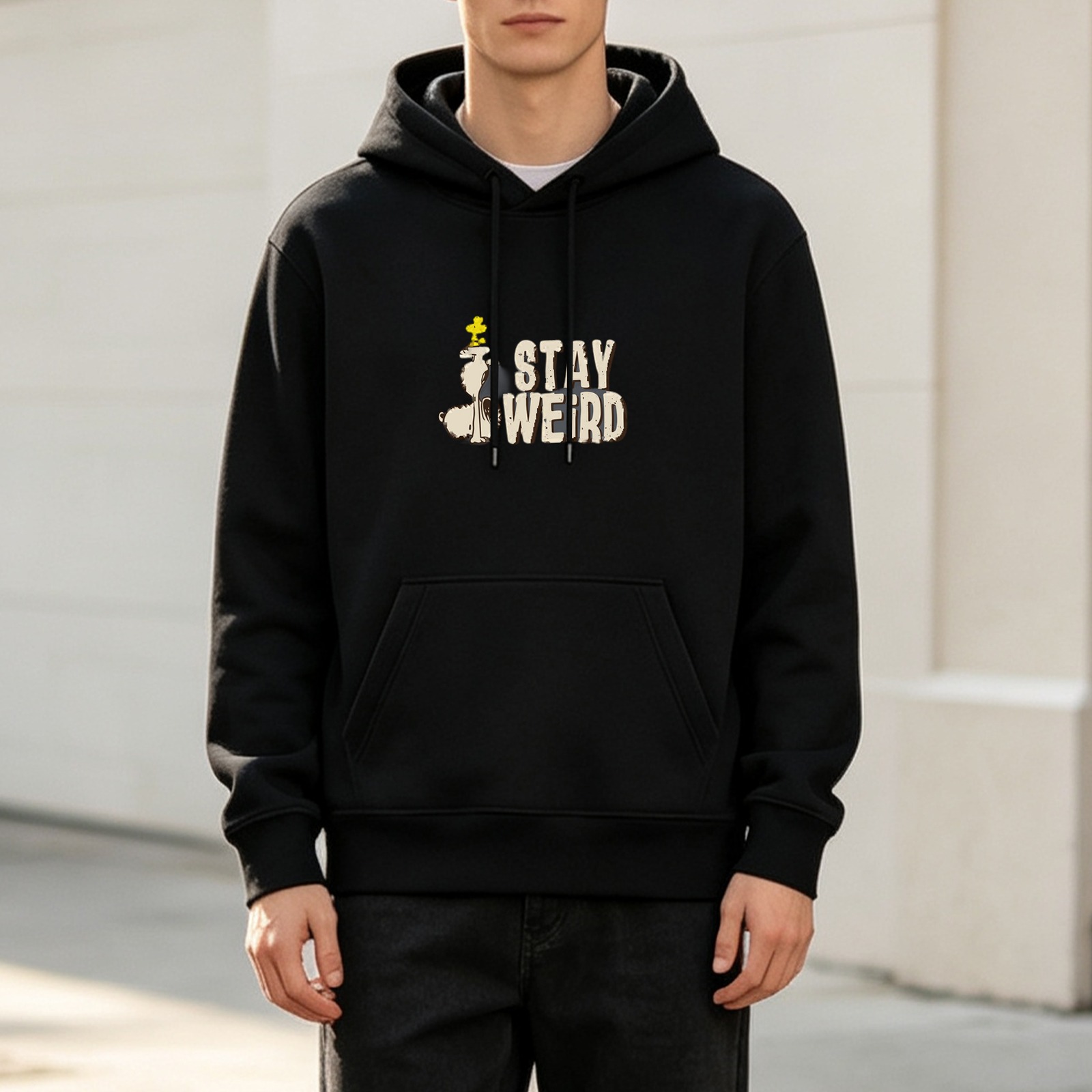 Black hoodie with 'STAY WEIRD' and Peanuts characters graphic