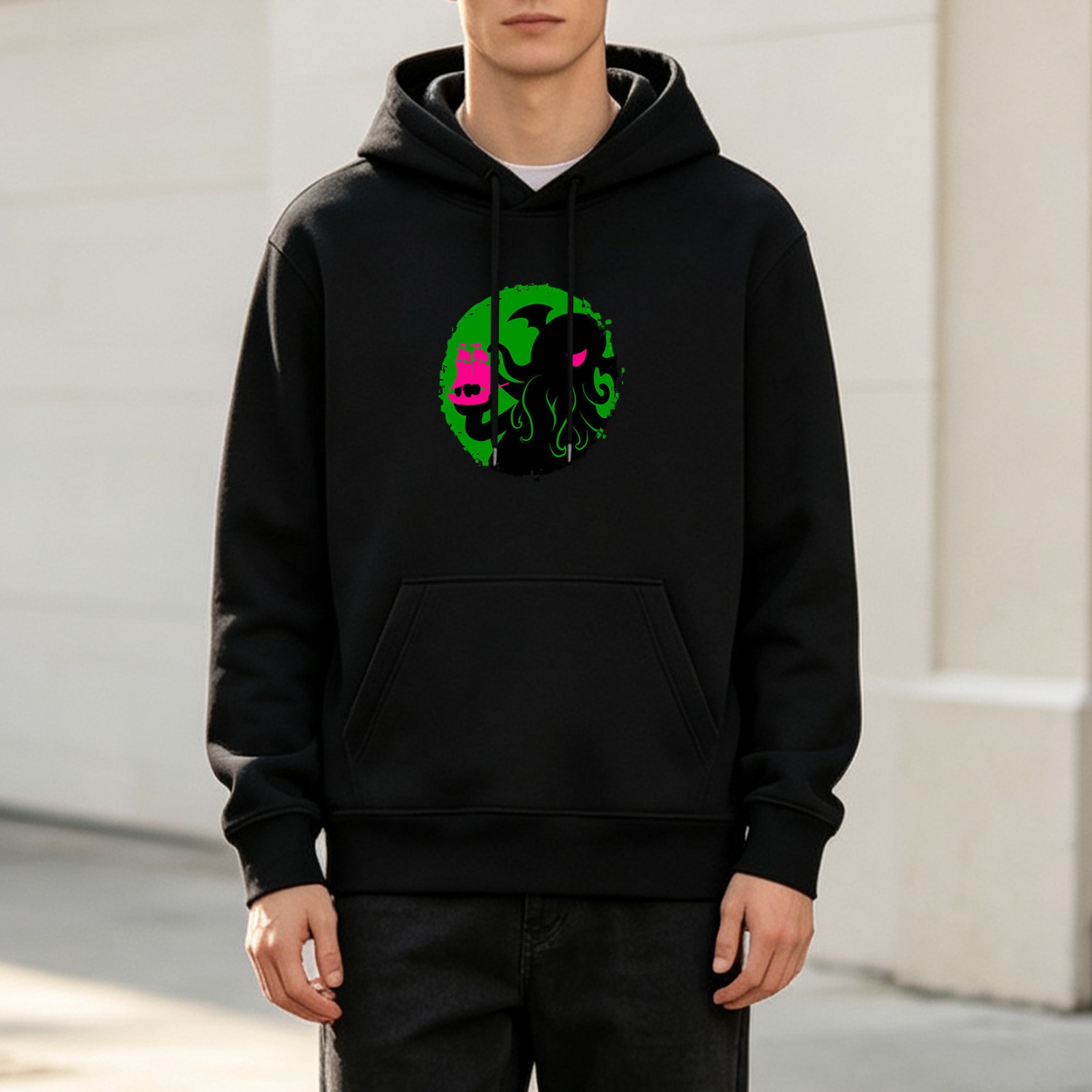Black hoodie with cthulhu holding a pink cat graphic