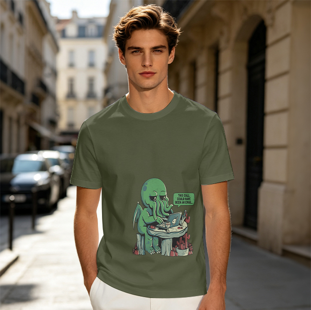 Olive green t-shirt with a bored Cthulhu working on a laptop print