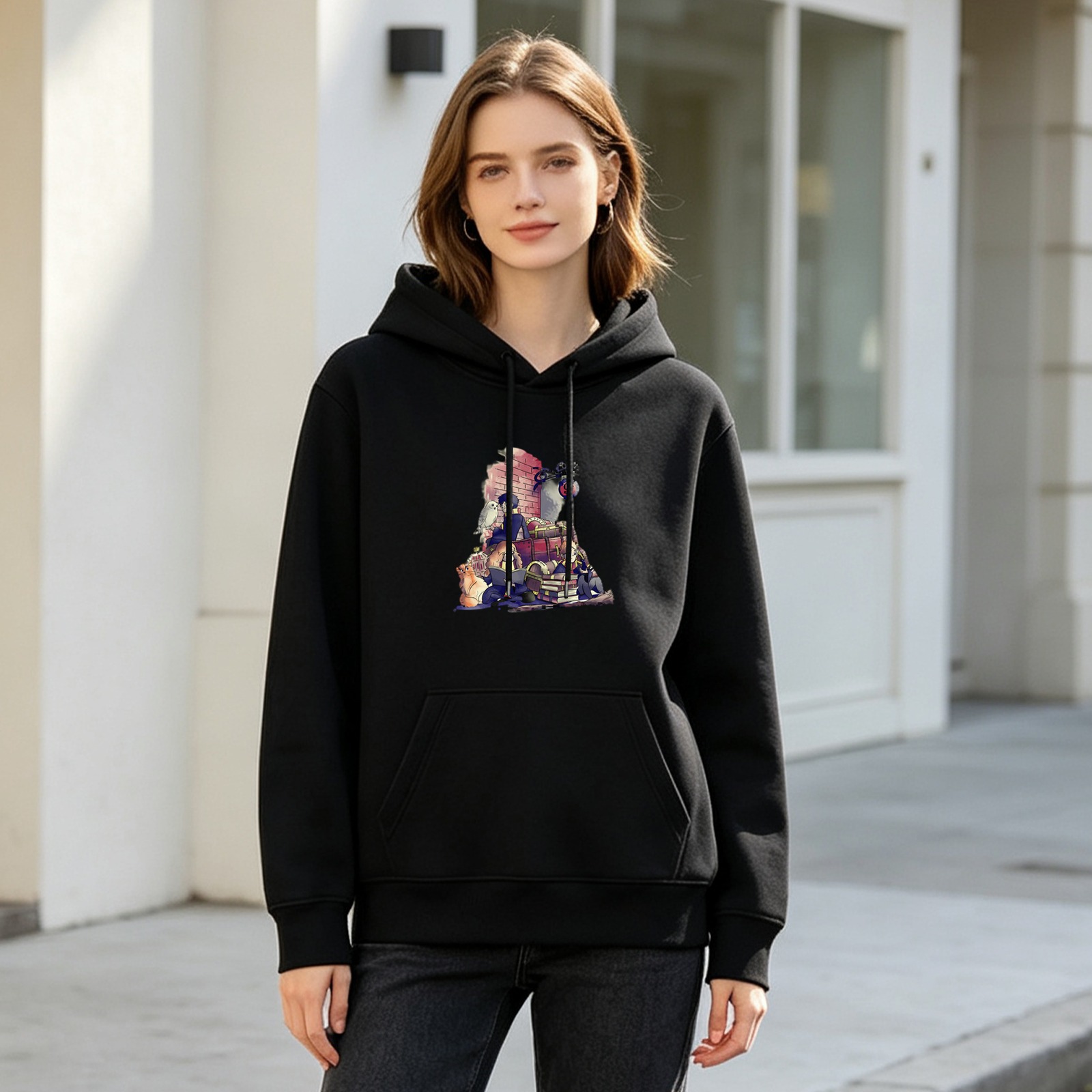 Black hoodie with magical animal and book graphic design