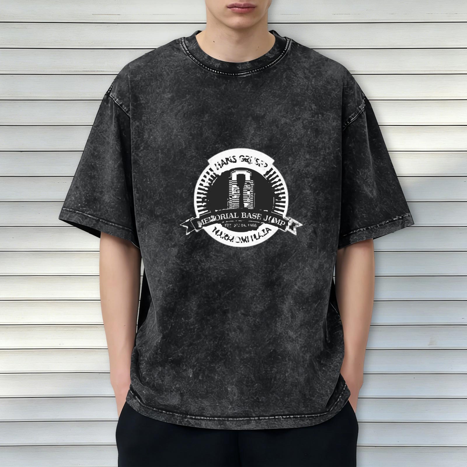 Oversized Acid-Wash Black Graphic T-Shirt with 'Hans Gruber Memorial Base Jump' Print