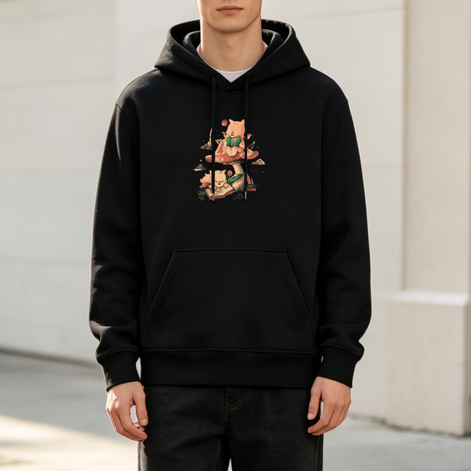 Black hoodie with whimsical mushroom and cat reading illustration