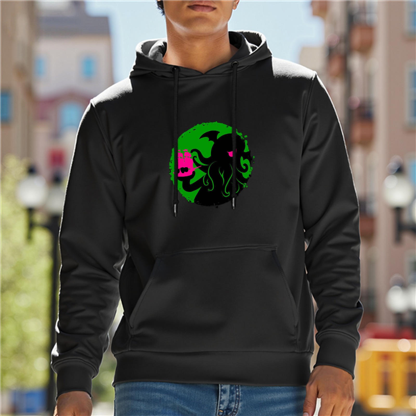 Black hoodie with cthulhu holding a pink cat graphic