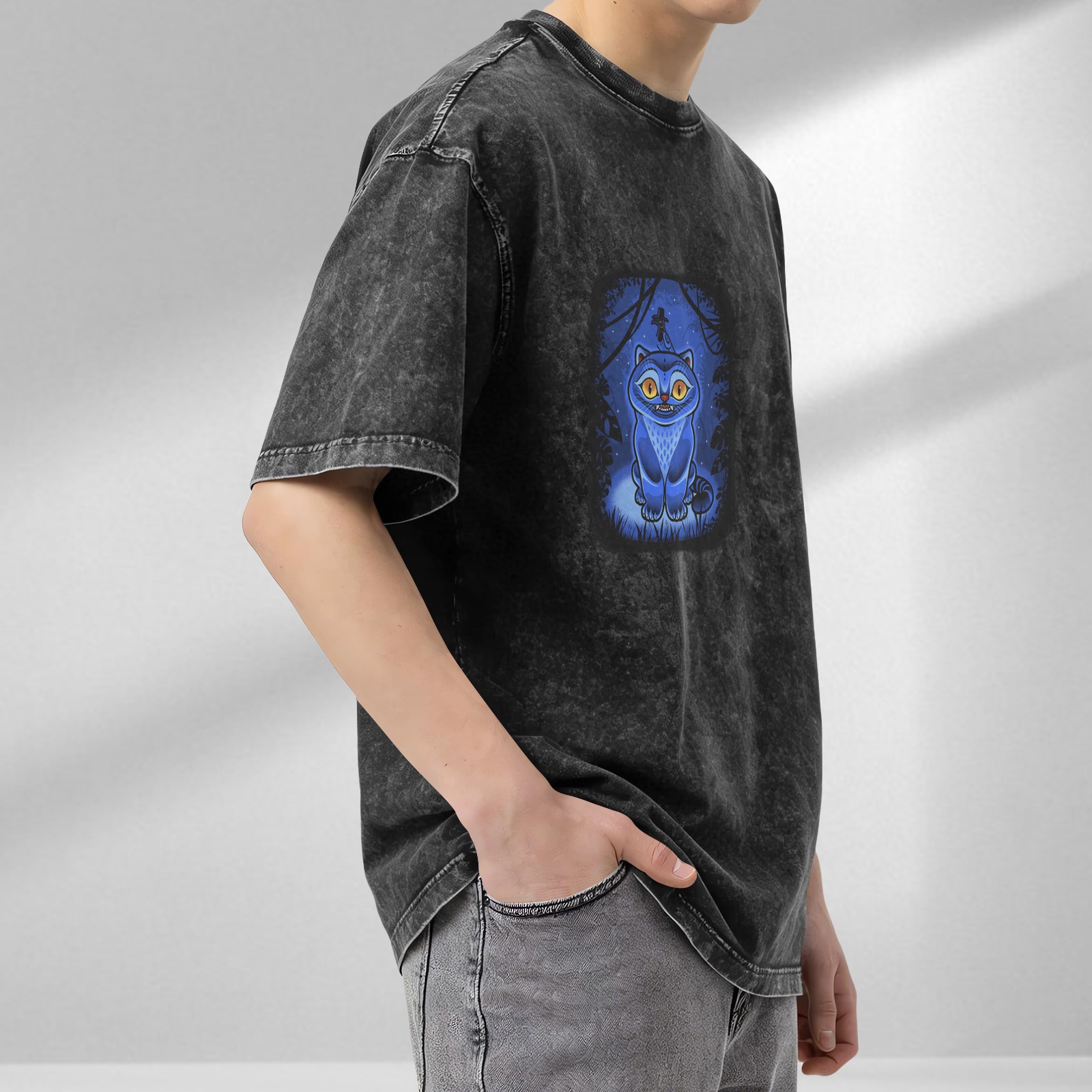 oversized black acid wash t-shirt with blue fantasy cat graphic