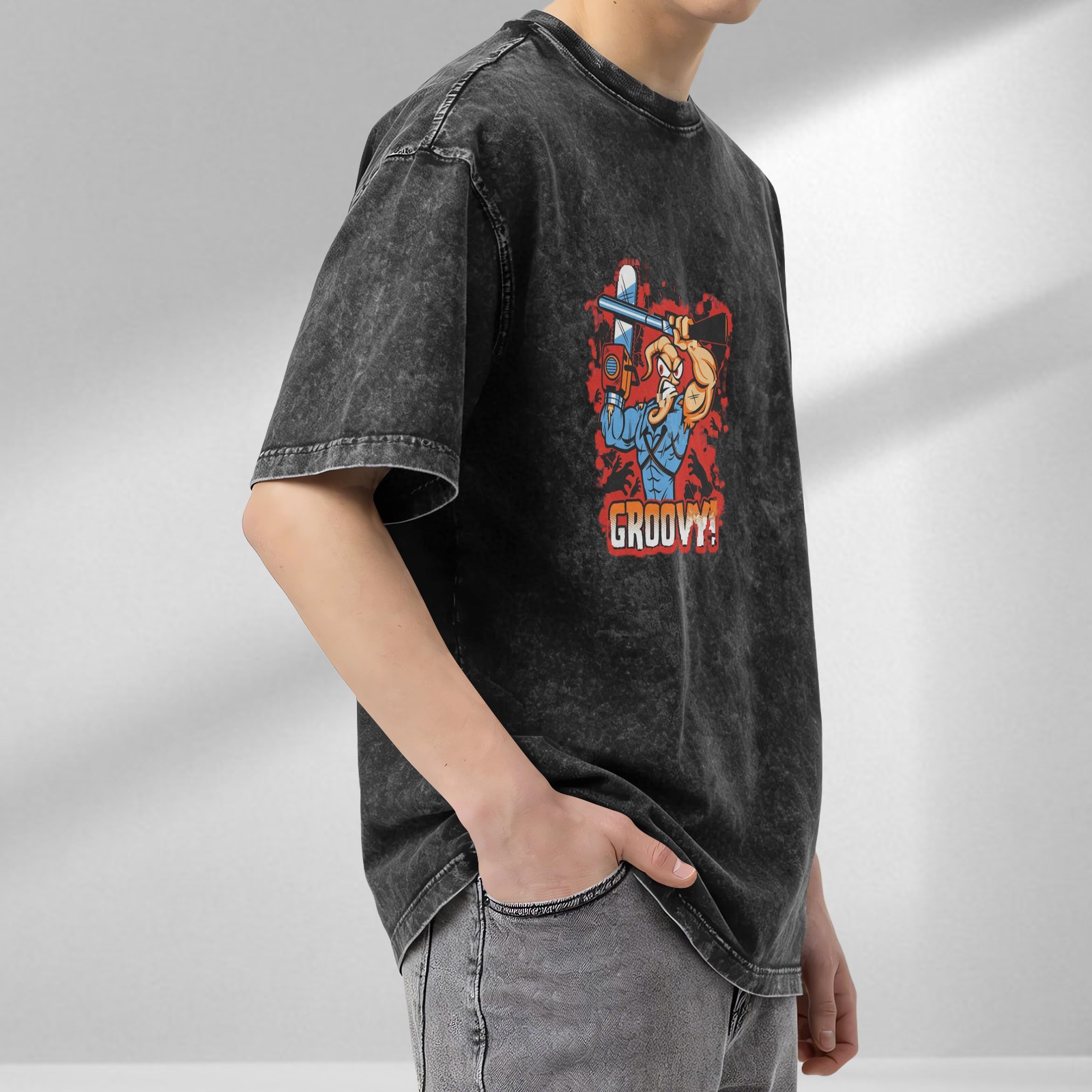 Vintage Washed Black T-Shirt with Cartoon Muscle Character Holding Chainsaw and 'GROOVY!' Graphic Print