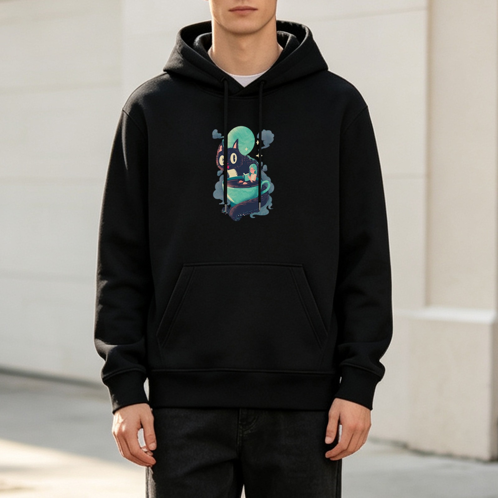 Black hoodie with a whimsical black cat in a teacup graphic