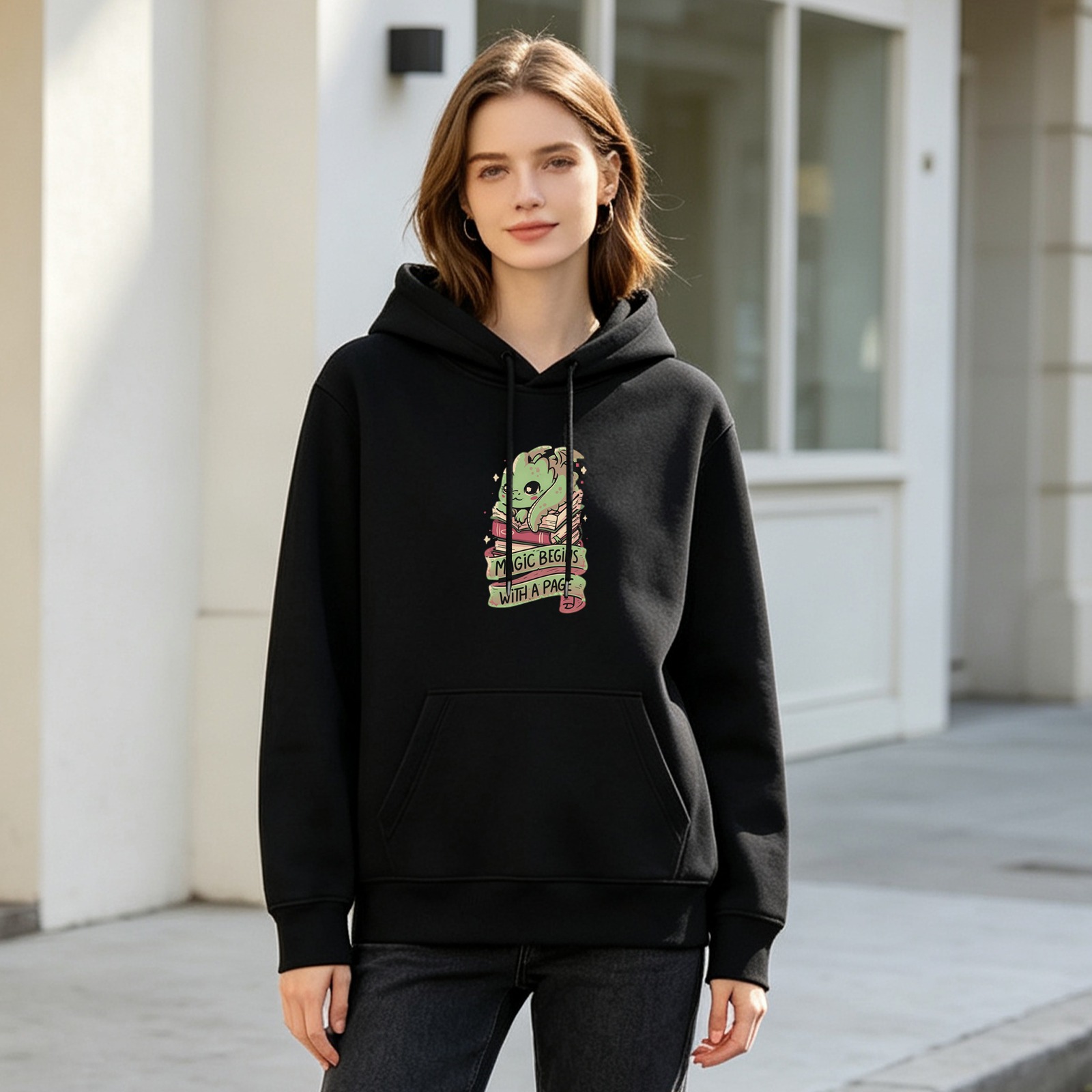 Black hoodie with cute dragon and 'Magic Begins With A Page' print