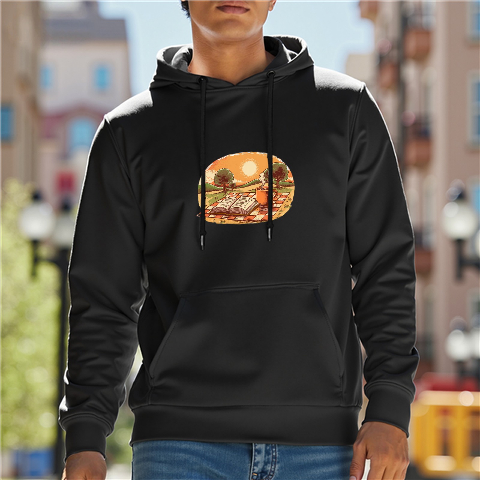 Black hoodie with sunset picnic and open book graphic