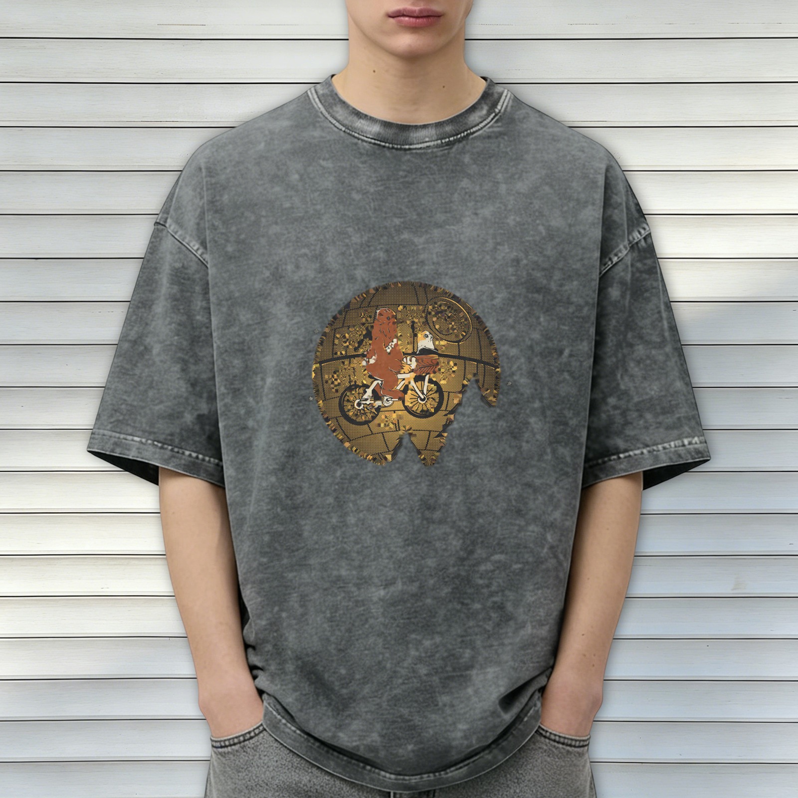 Washed black graphic t-shirt with alien on bike over gold globe design