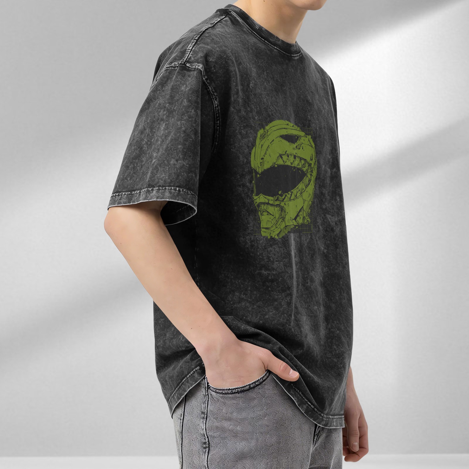 Washed black oversized t-shirt with green damaged helmet graphic
