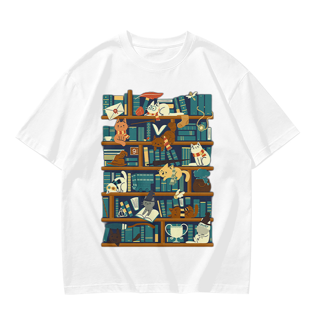 Olive t-shirt with playful cats on a bookshelf graphic