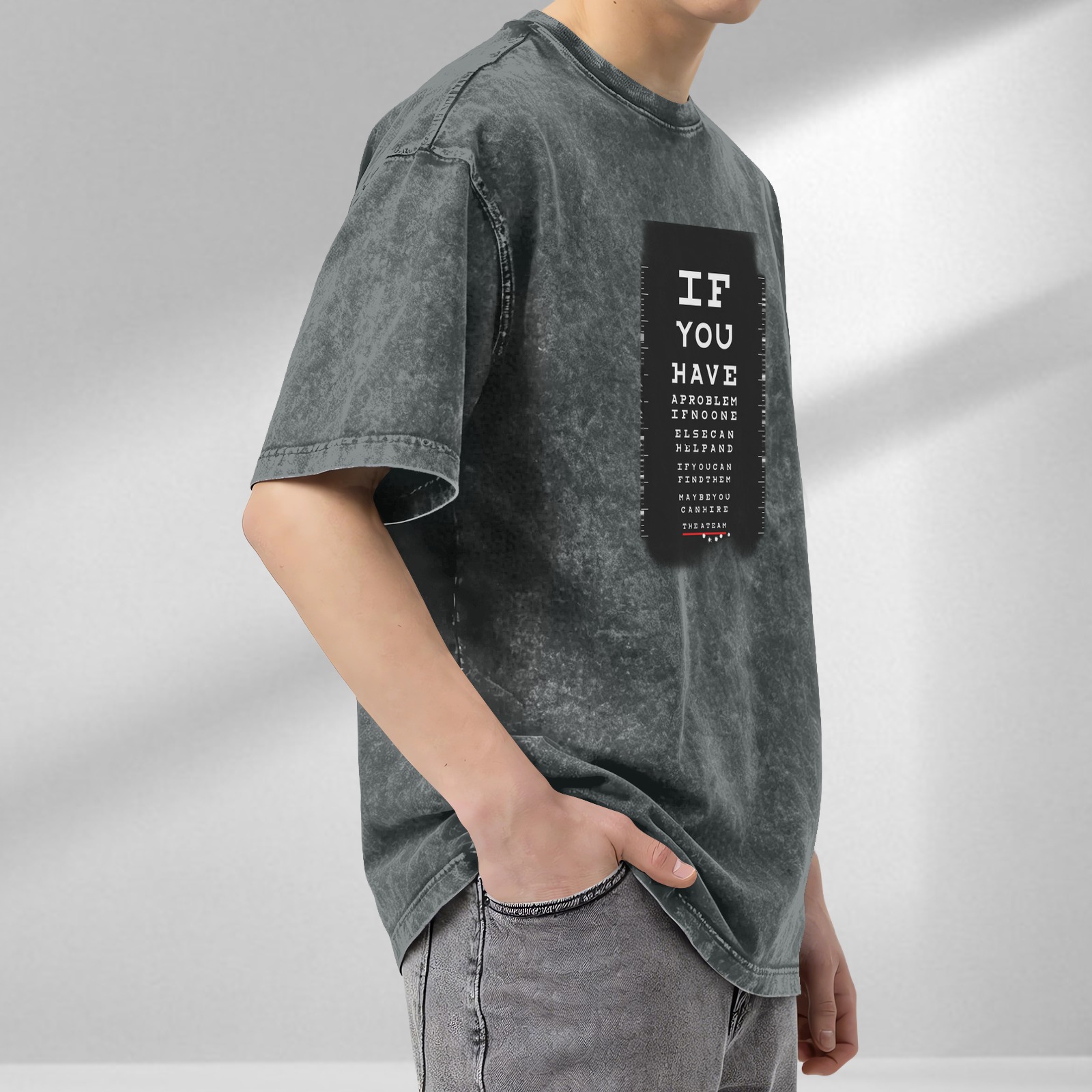 Washed black graphic t-shirt with eye chart style text design