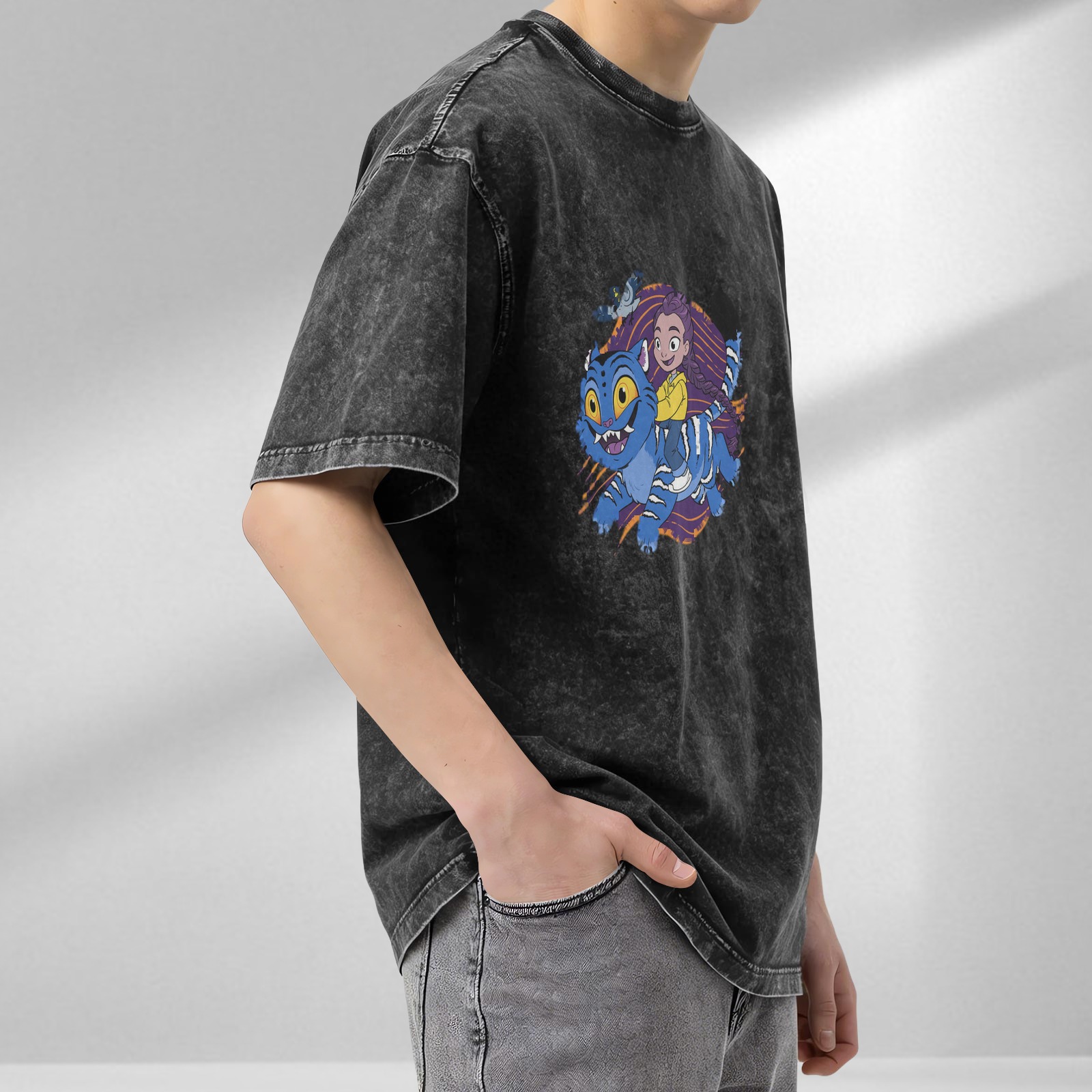 Washed black graphic t-shirt with cartoon girl riding blue fantasy cat design