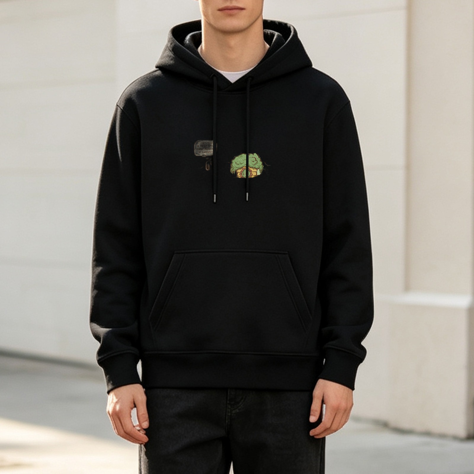Black Hoodie With Small Whimsical Green Graphic Print