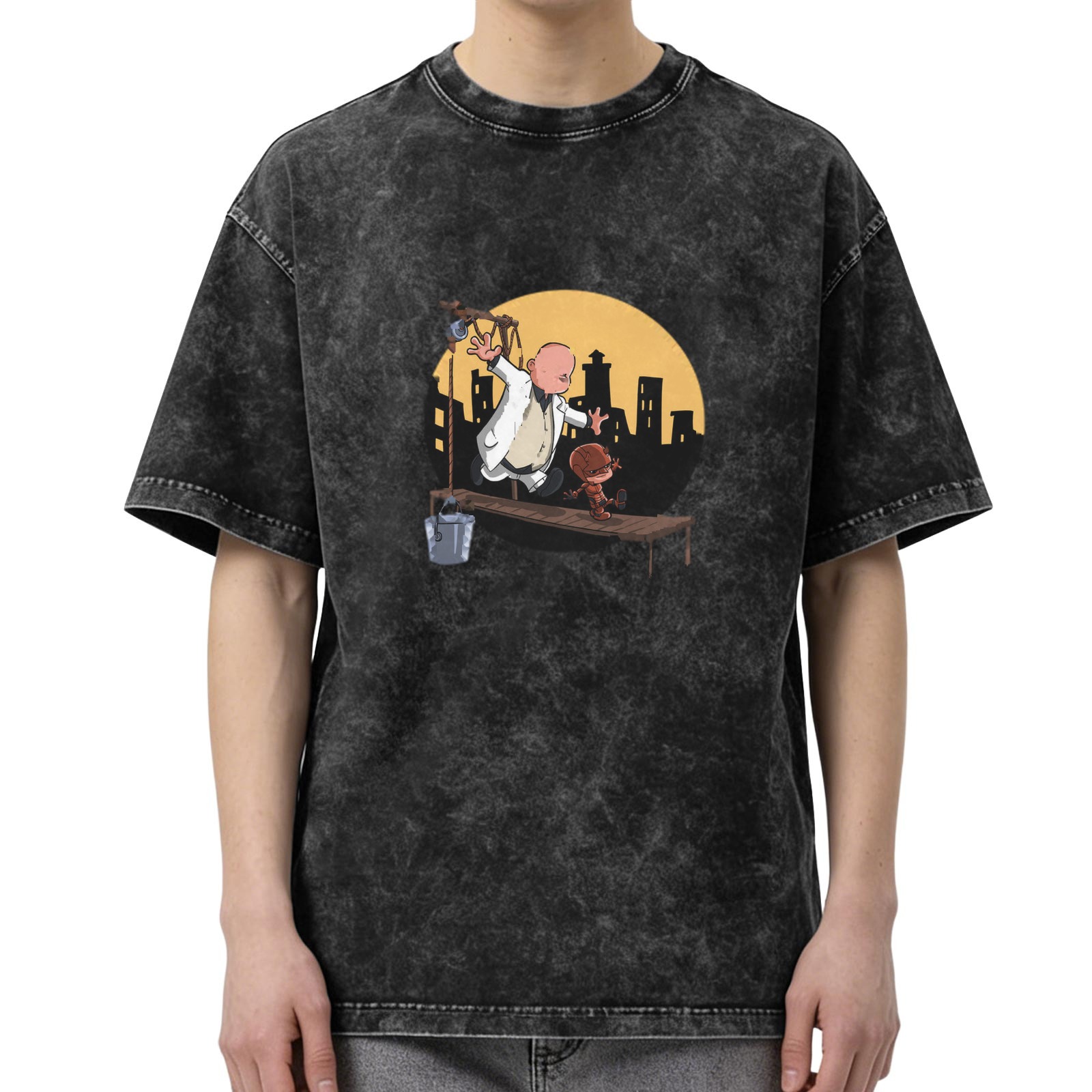 Washed black graphic t-shirt with cartoon characters on a scaffold city skyline