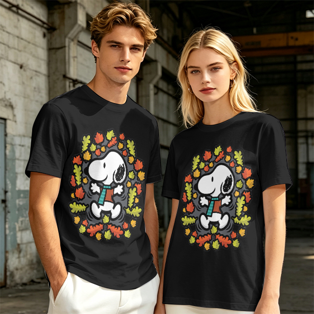 Olive green t-shirt with Snoopy playing in autumn leaves