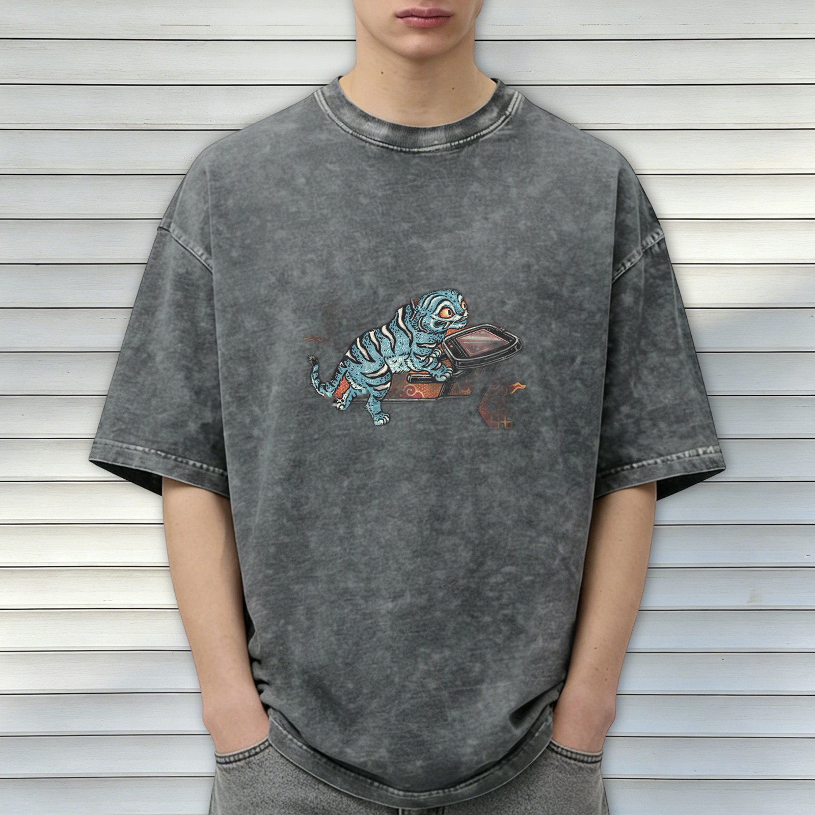 Oversized acid wash t-shirt with blue tiger riding retro device graphic