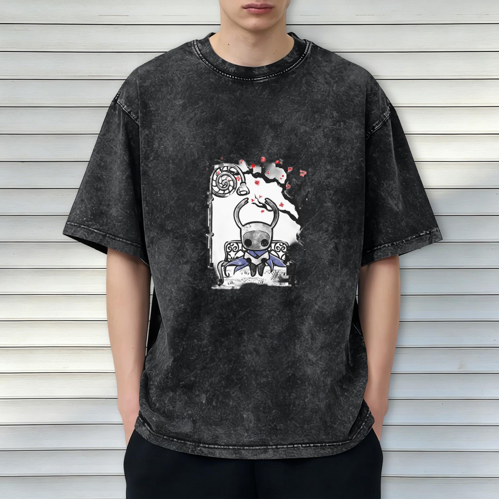 Washed black graphic t-shirt with Hollow Knight character on bench