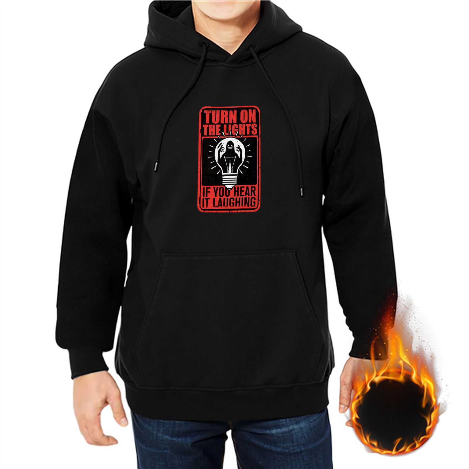 Black hoodie with 'Turn on the lights if you hear it laughing' graphic