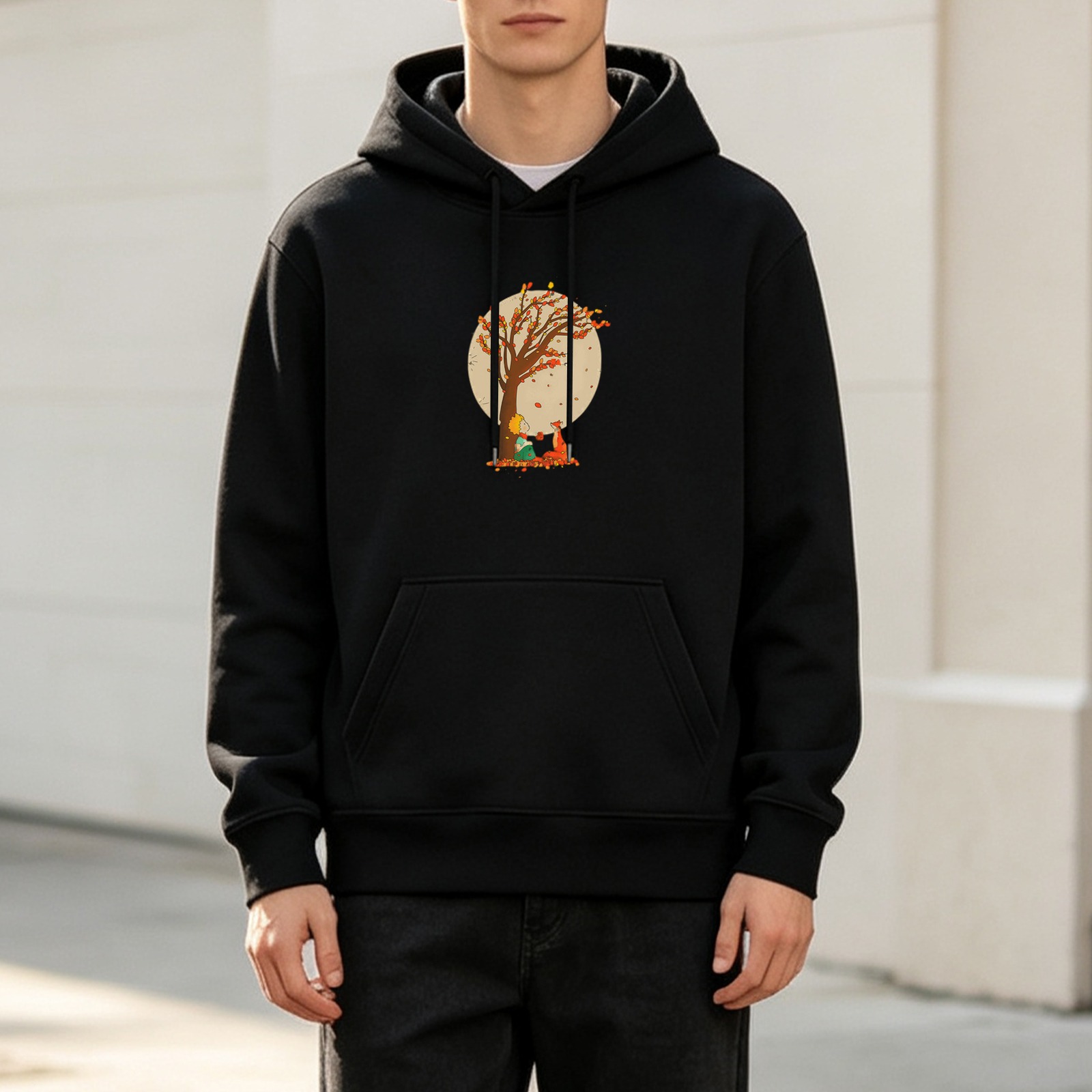 Black hoodie with autumn tree and small figure graphic