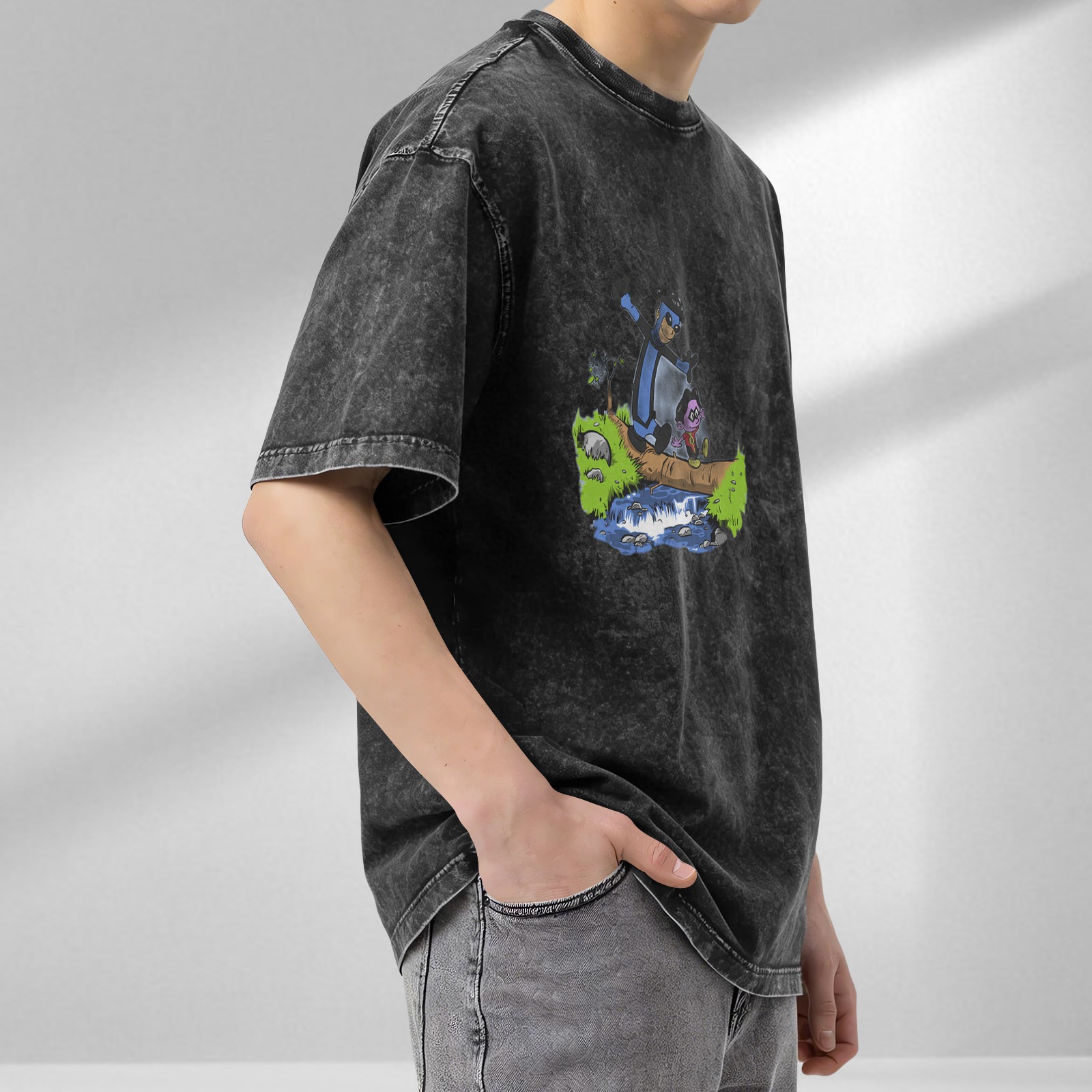 Oversized acid wash t-shirt with cartoon characters crossing a log over a stream
