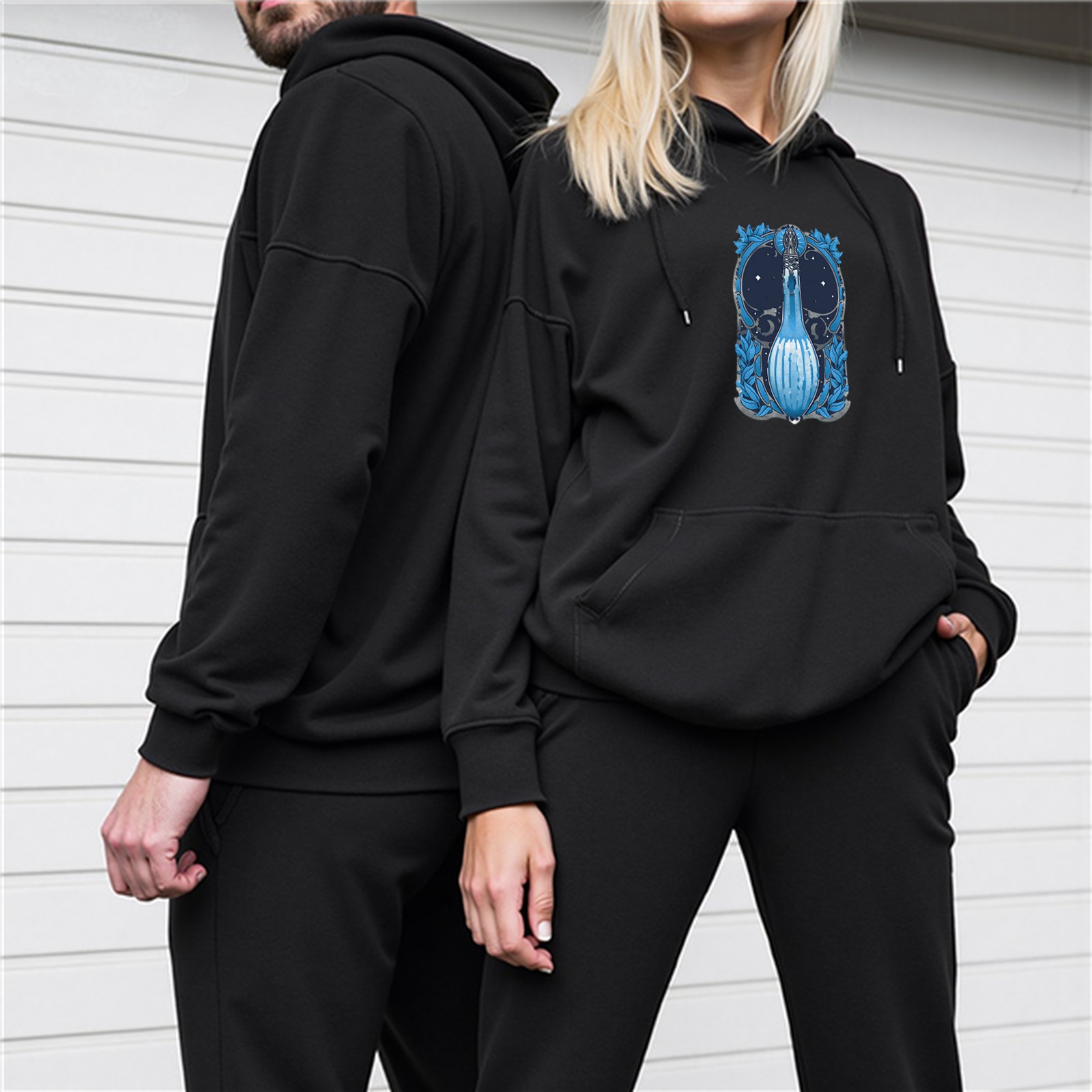 Black hoodie with blue magical potion bottle graphic