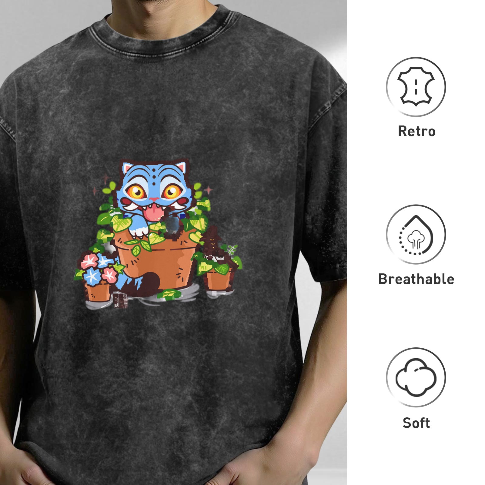Washed black oversized t-shirt with playful blue cat in plant pots graphic