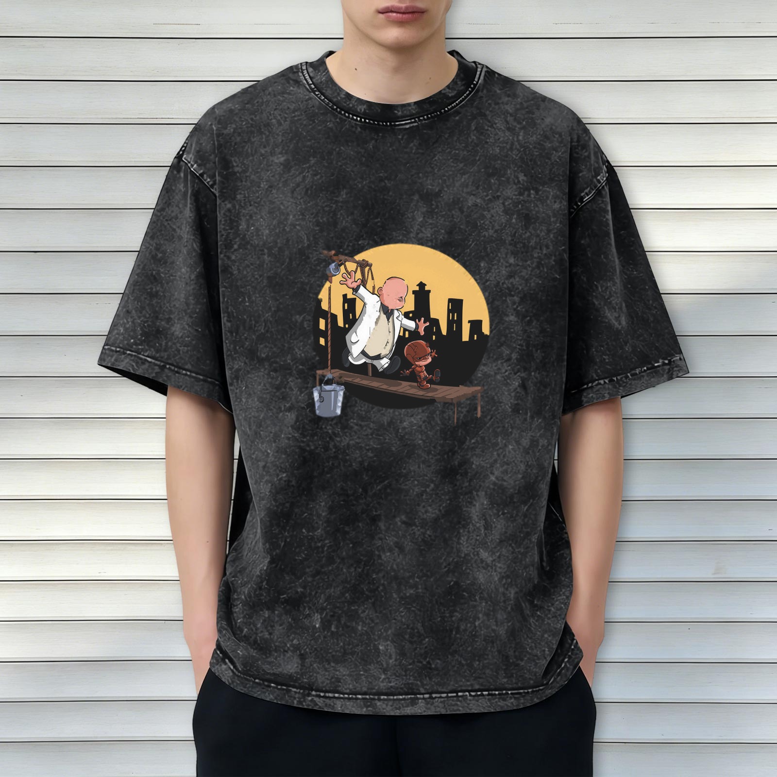 Washed black graphic t-shirt with cartoon characters on a scaffold city skyline