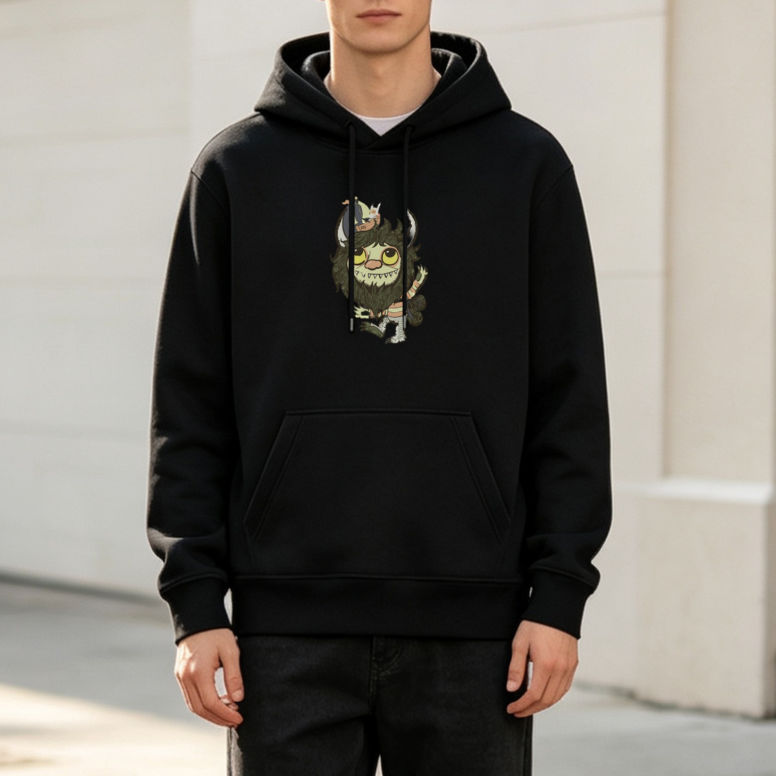 Black hoodie with Where the Wild Things creature graphic print