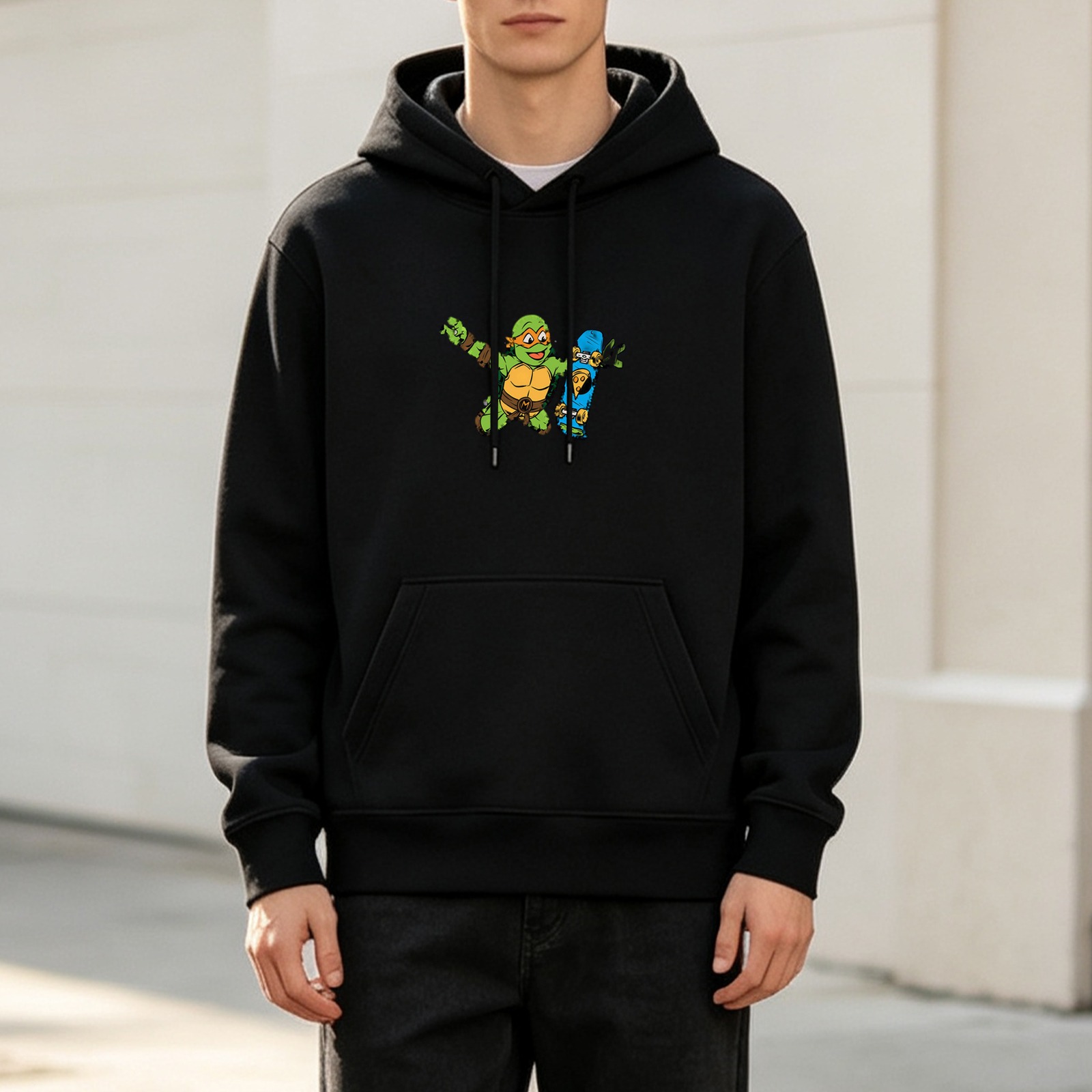 Black hoodie with cartoon ninja turtle and skateboard graphic