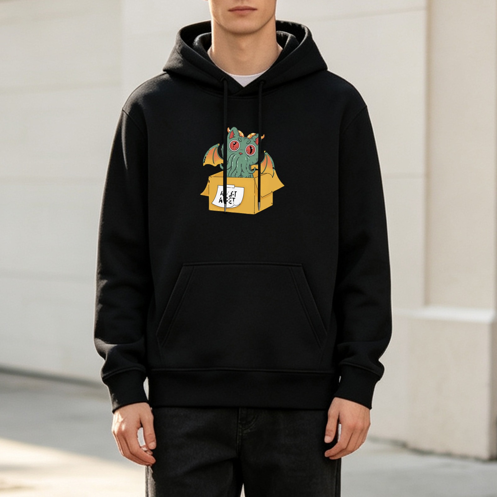 Black hoodie with cute cthulhu in a box graphic