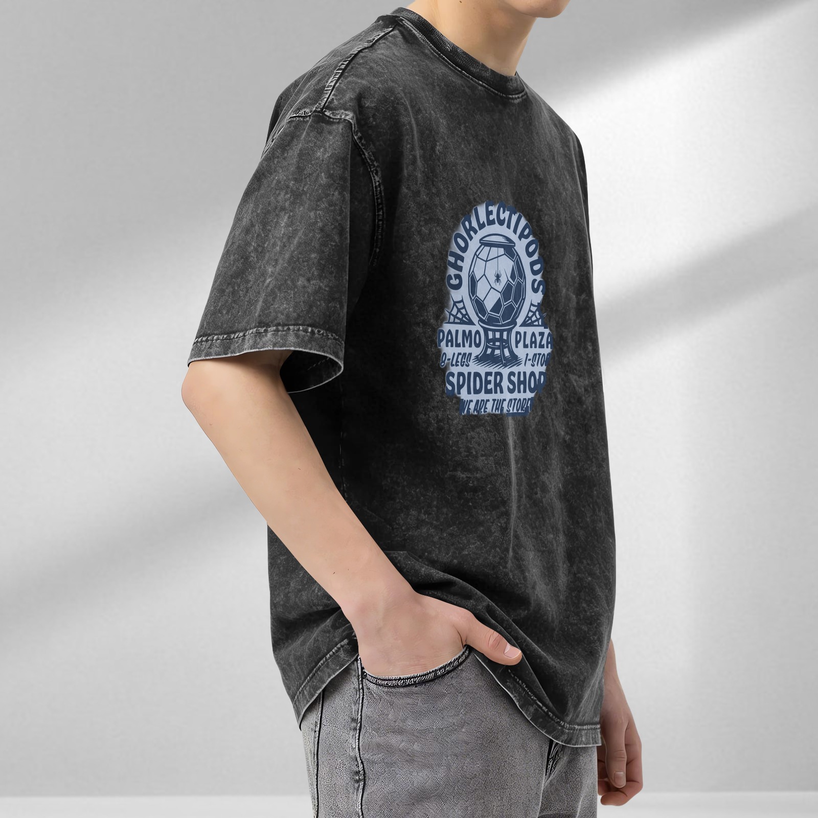 Washed black graphic tee with spider shop themed print