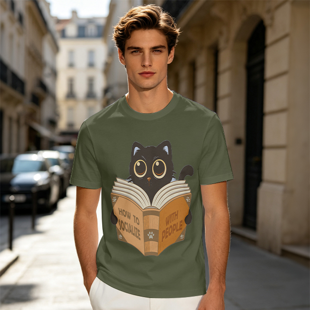 Olive t-shirt with a black cat reading How to Socialize With People book