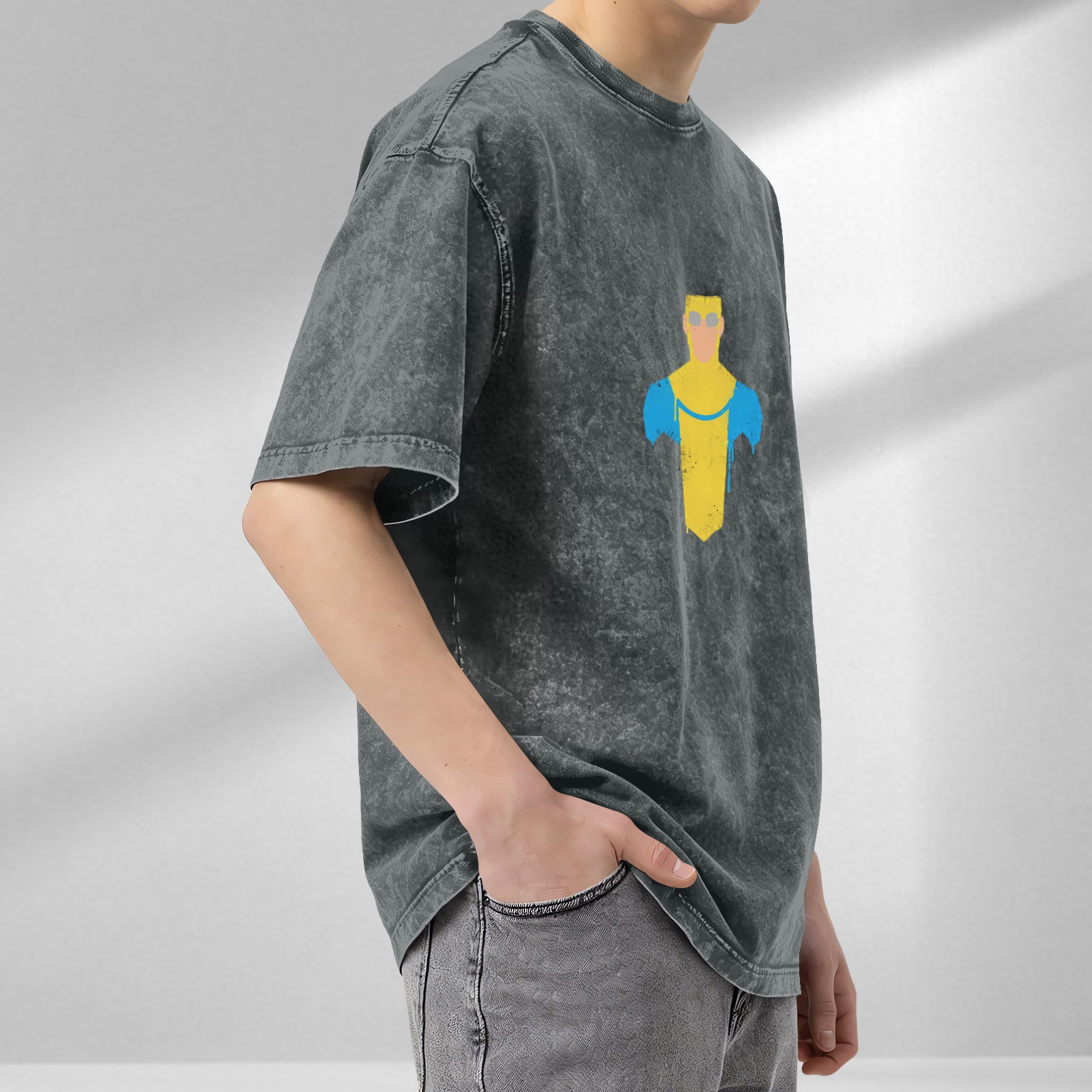 Distressed washed black loose short-sleeved T-shirt with minimalist superhero print on the chest