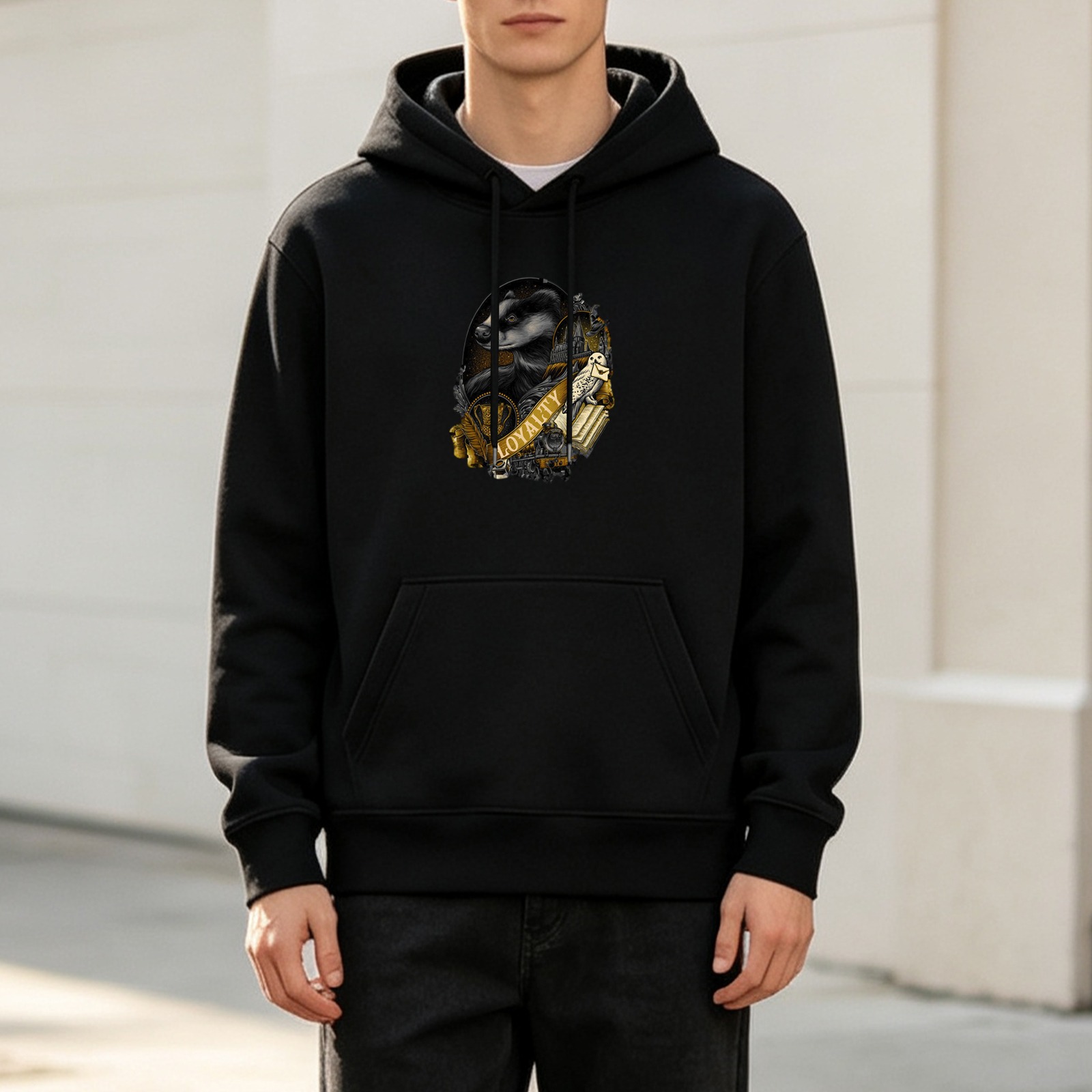 Black hoodie with Hufflepuff badger loyalty crest graphic