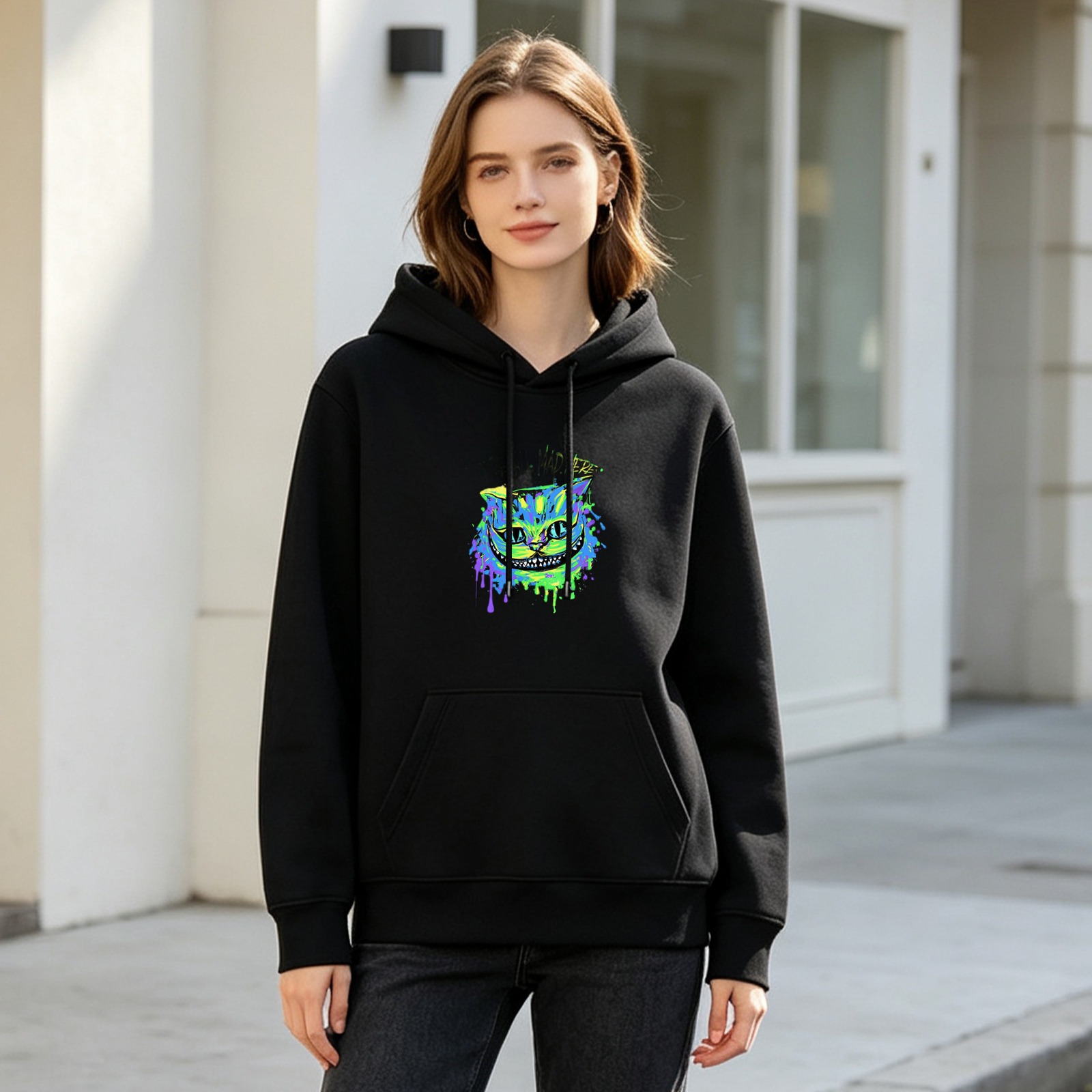 Black hoodie with neon Cheshire cat paint splatter graphic
