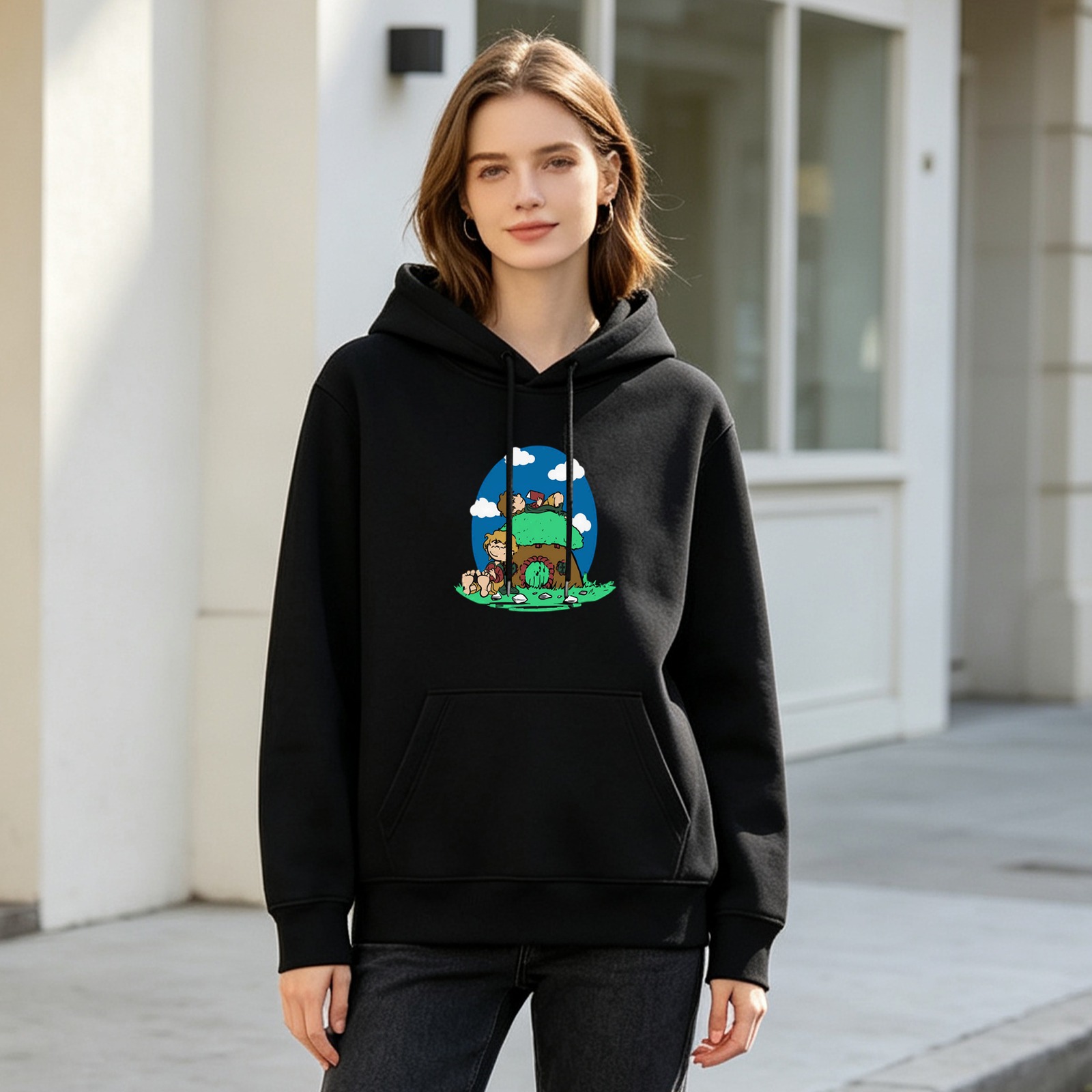 Black hoodie with mushroom house and cartoon characters graphic